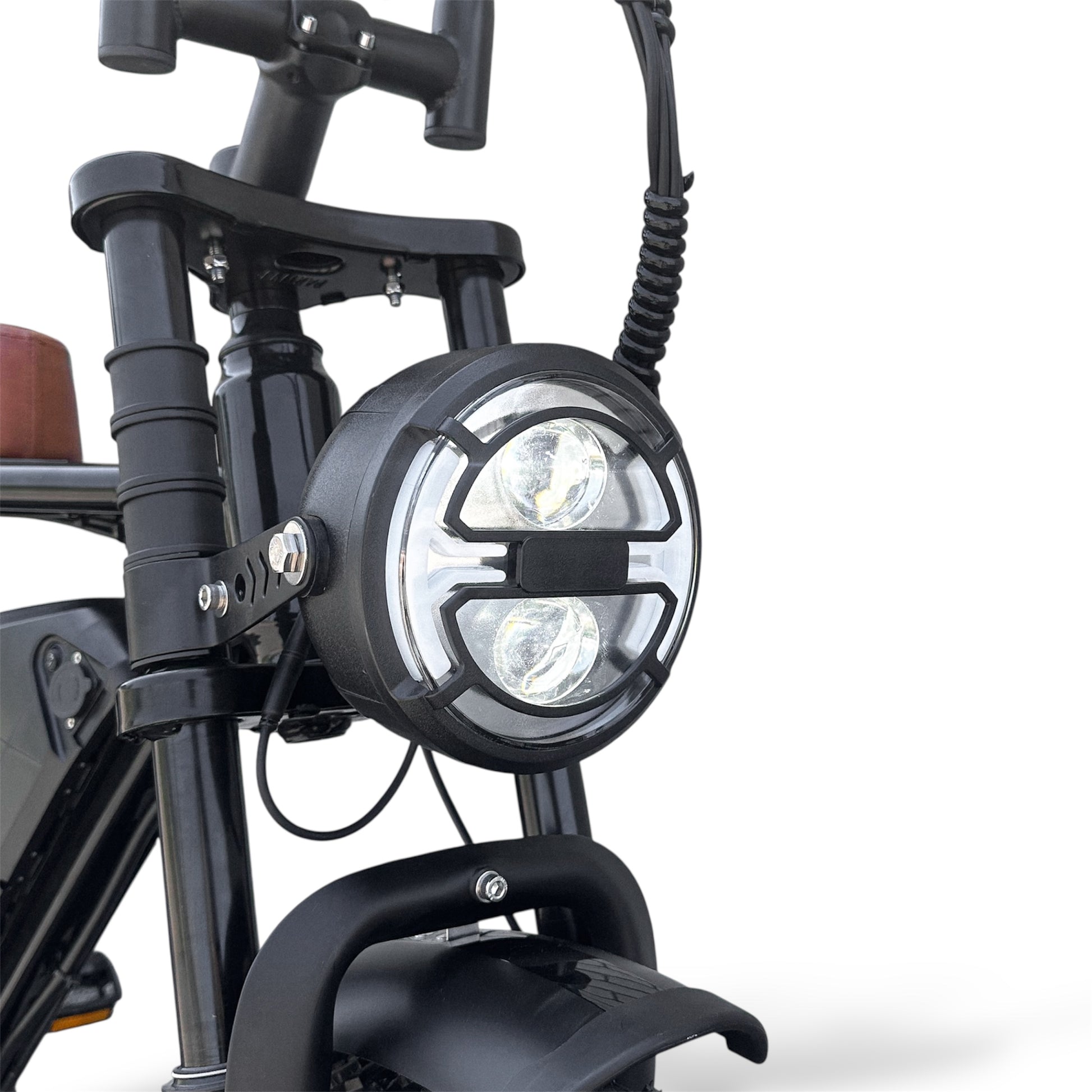 Close-up of a Ebike headlight and signal light on a white background