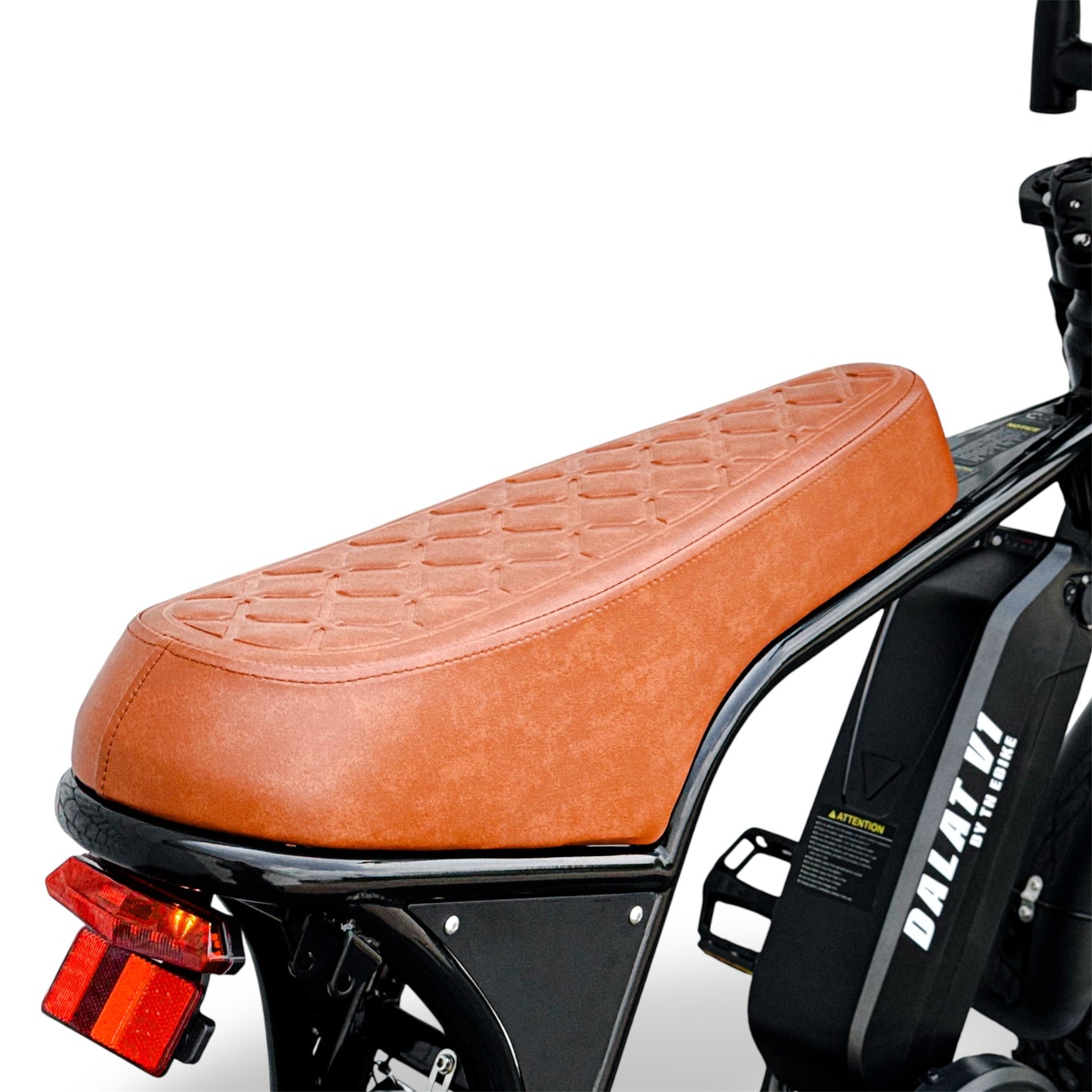 Brown leather seat on a motorcycle style electric bike with visible branding on a white background