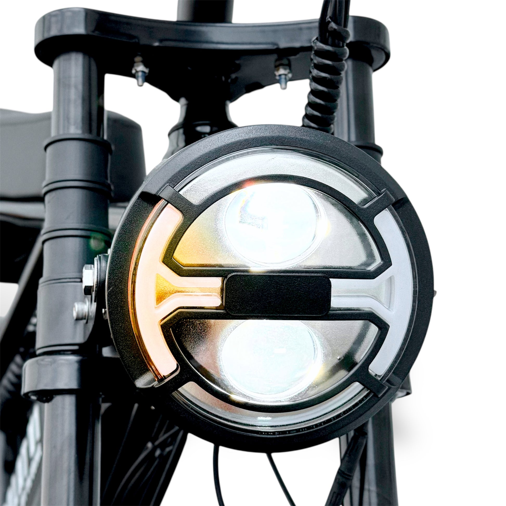 Close-up of a ebike headlight with yellow signal light