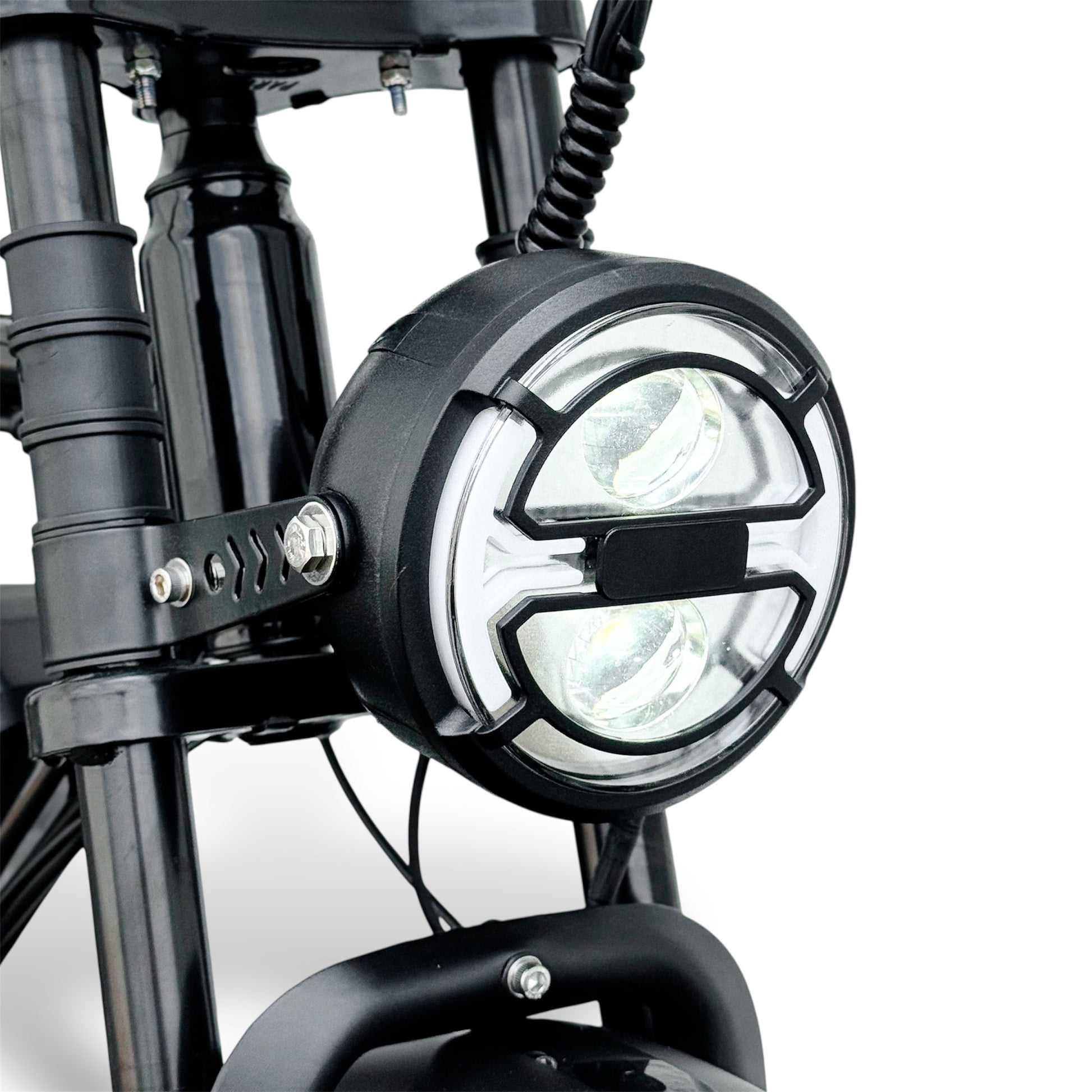 Close-up of an electric bike headlight with a clear background