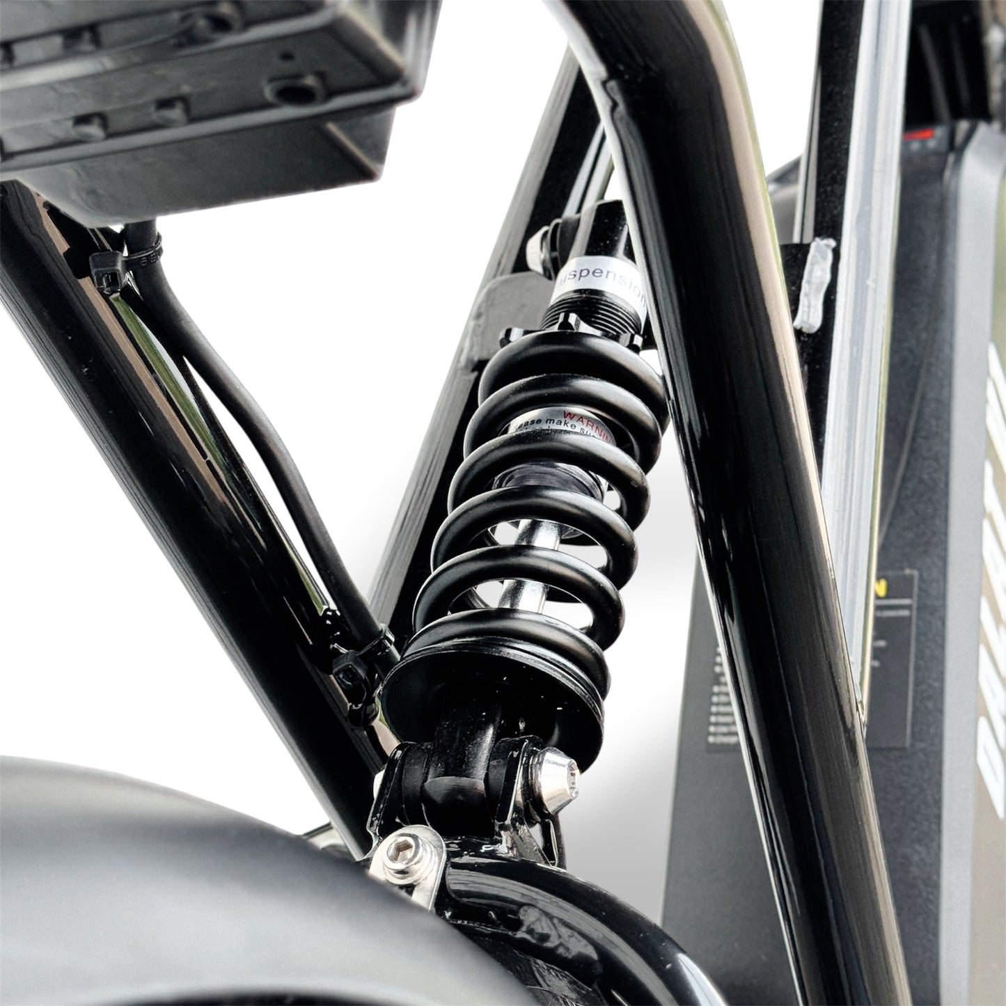 Close-up of an Ebike rear suspension with a white background