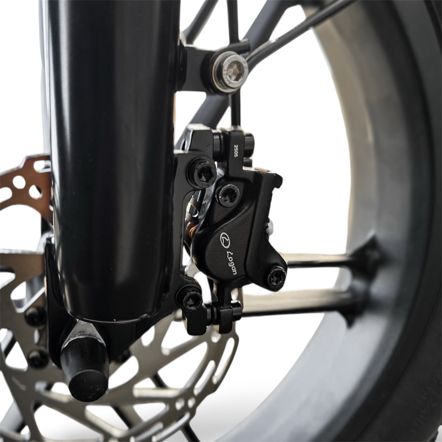 Close-up of Dalat V1 Beast Ebike Logan hydraulic brake system with a blurred background
