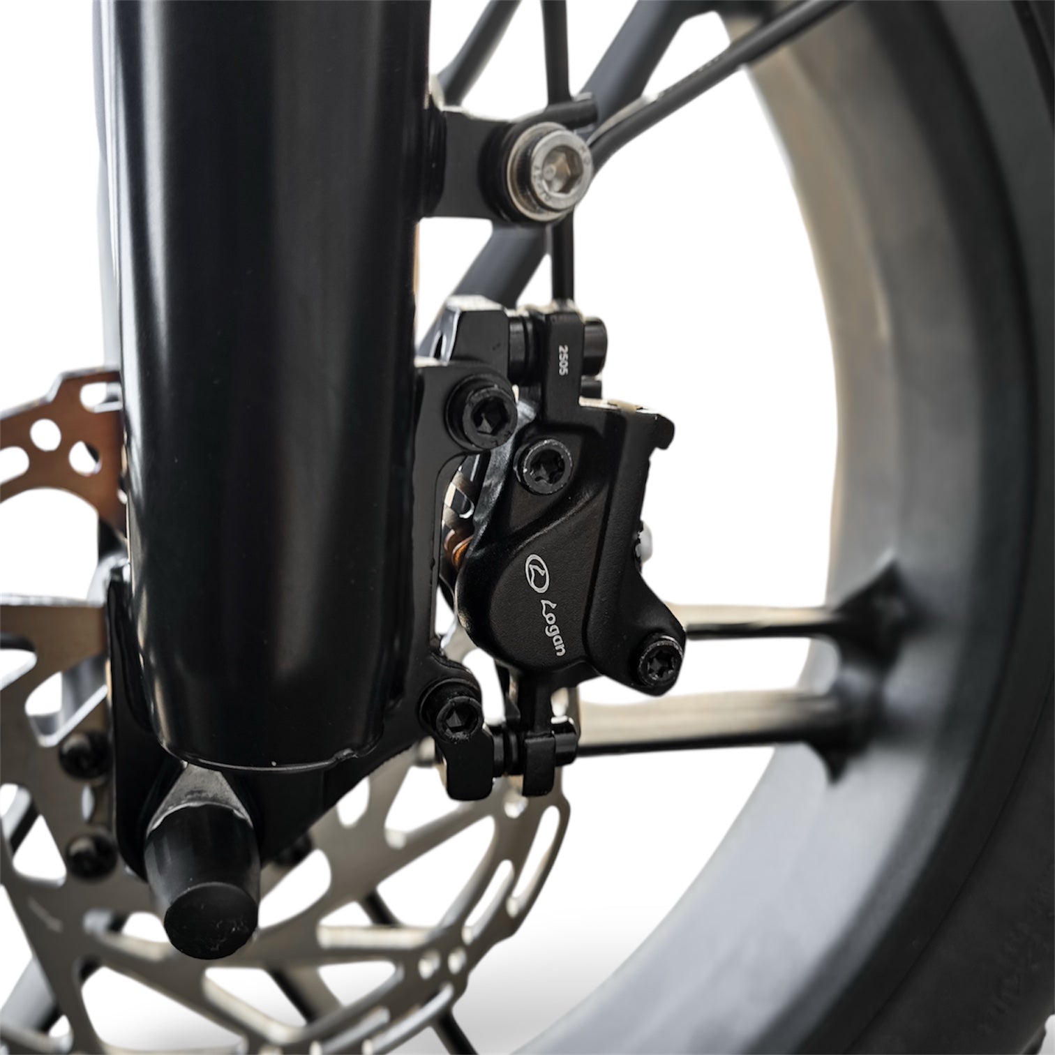 Close-up of Dalat V1 Beast Ebike Logan hydraulic brake system with a blurred background