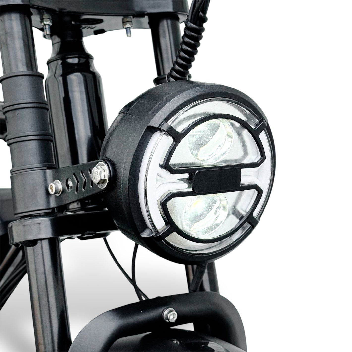 Close-up of an electric bike headlight with a clear background