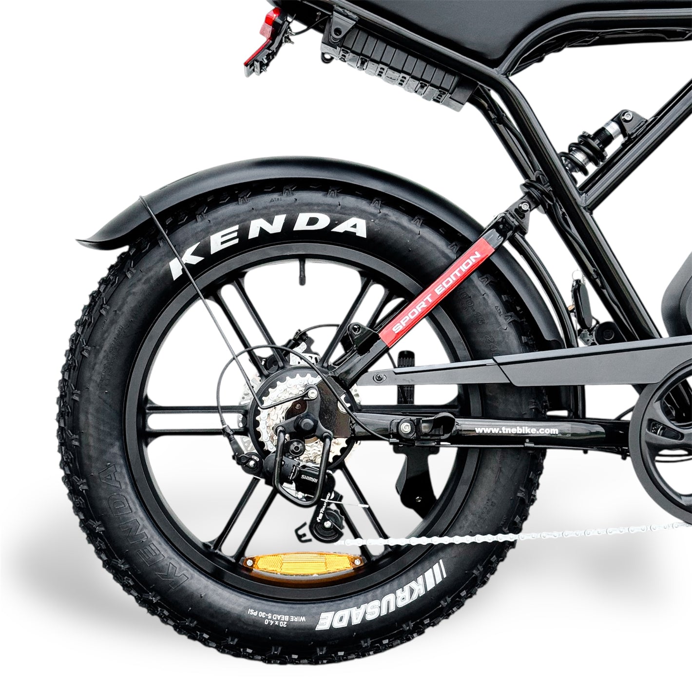 Close-up of a Ebike rear wheel motor with Kenda fat tire on white background