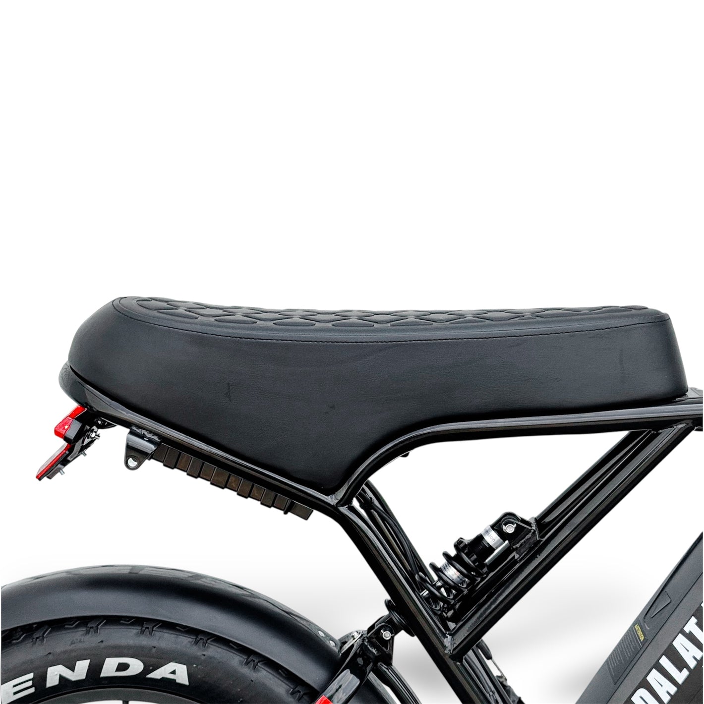 Close-up of a black electric bike seat with visible branding on a white background
