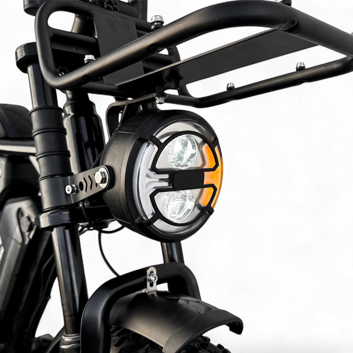 Close-up of a motorcycle headlight with black frame and white light on a white background, intergrated signal light