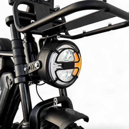 Close-up of a motorcycle headlight with black frame and white light on a white background, intergrated signal light